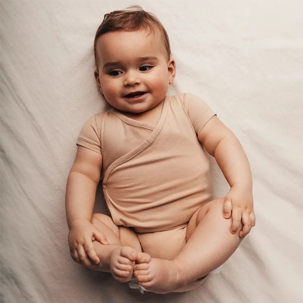 Omslag rompertje Joia (rose salmon)