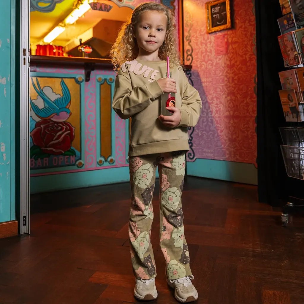 Broek Holt flared (aop green flower)