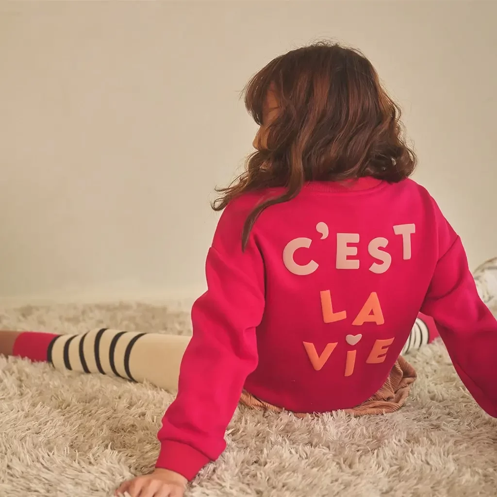 Trui Konono backprint (cerise pink)