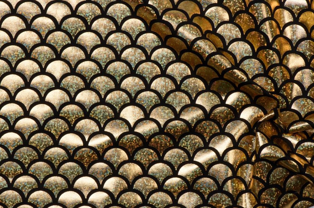 Lycra bedrukt met gouden schubben