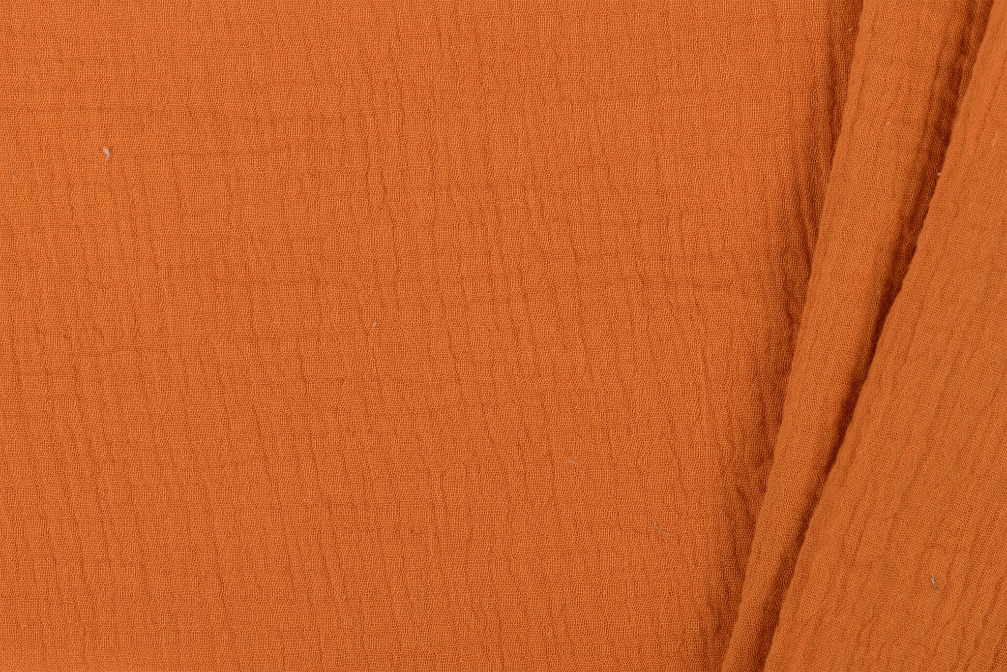 Hydrofiel Stof Dusty Oranje – Zacht, Ademend en Duurzaam