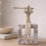 PTMD Ornament Aleria Beige dame met fluit op marmeren voetstuk