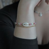 Armbandje cowrie shell