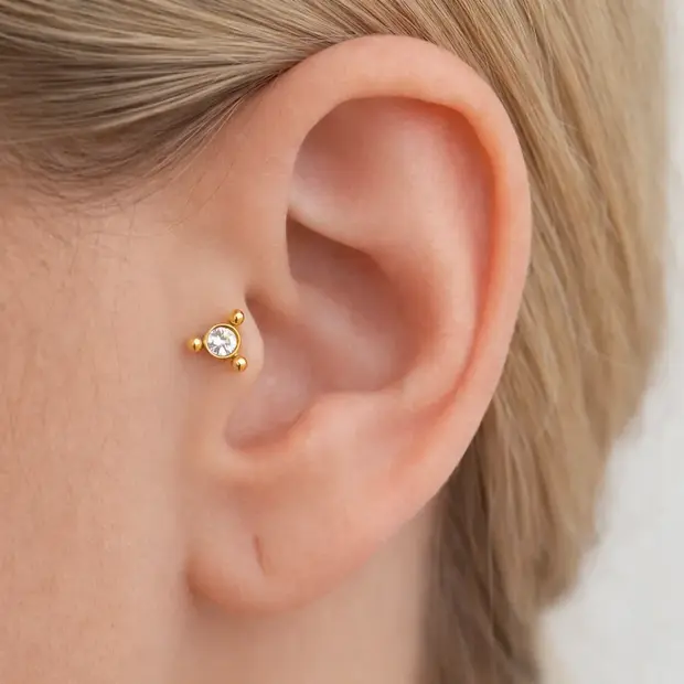 Piercing zirkonia triangle gold dot