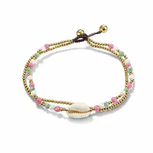 Enkelbandje cowrie schelp